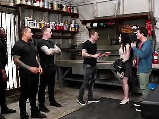 Slutty girl is fucked by a bunch of guys in a warehousde